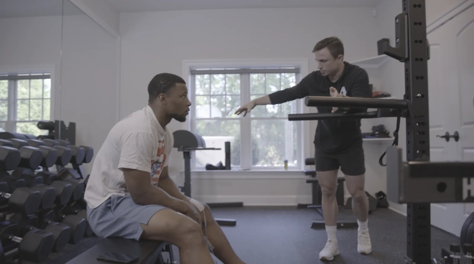 Evan Lewis working with Saquon Barkley during an Accelerate ACL training session