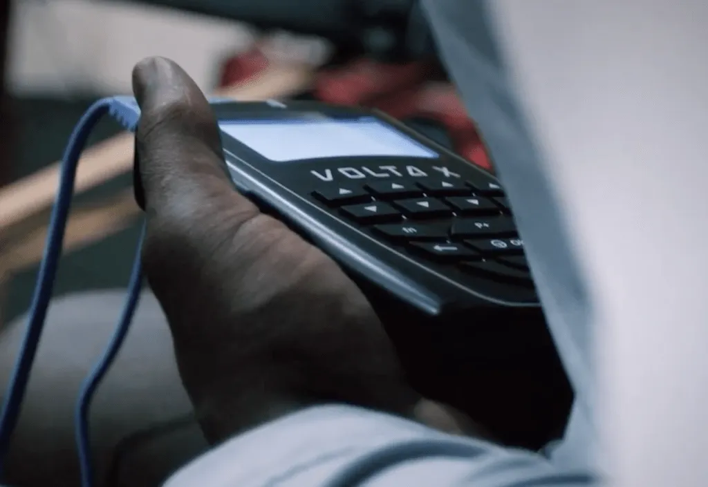 Close-up of Grady Jarrett holding the Volta X neuromuscular stimulation device during his ACL recovery