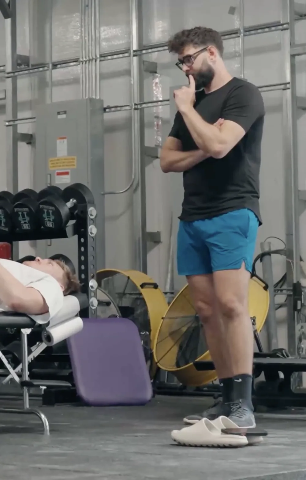 Dr. Jarod Burton, DC, reading an athlete's movement during a training session